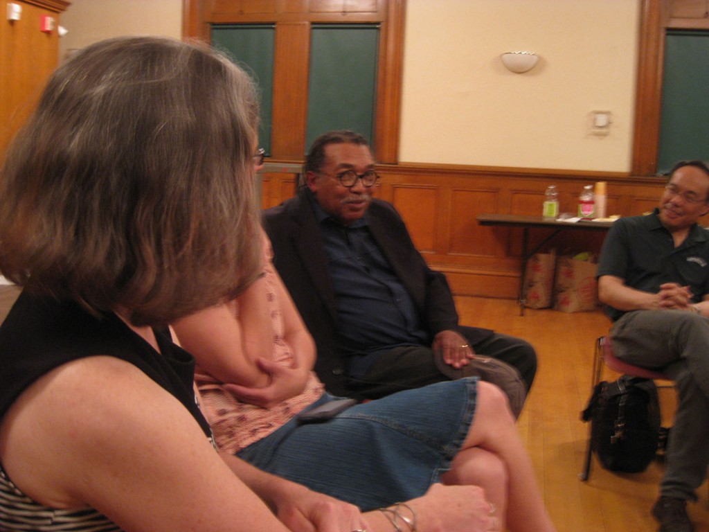 James Montford (center) talks during the group discussion at the "How to Be an Artist and a Parent" talk at the Malden library on May 12. (Tim Devin)