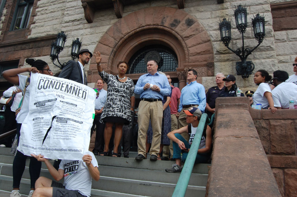 Cambridge Mayor E. Denise Simmons (center) and Vice Mayor Marc C. McGovern (right of her) speak with Black Lives Matter Cambridge protesters at Cambridge City Hall, Aug. 31, 2016. (Greg Cook)