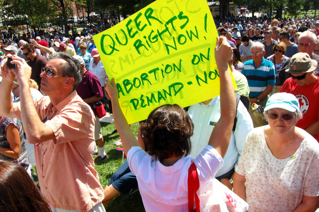 A protester of Franklin Graham's “Decision America Tour" prayer rally on Boston Common, Aug. 30, 2016. (Greg Cook)