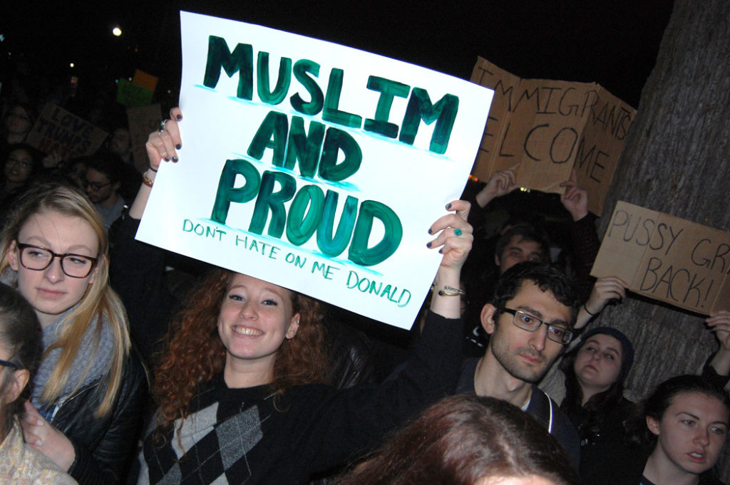 "Muslim and Proud. Don't Hate On Me Donald." "Immigrants Welcome." At "Protest Trump in Boston" at Boston Common, Nov. 9, 2016. (Greg Cook)