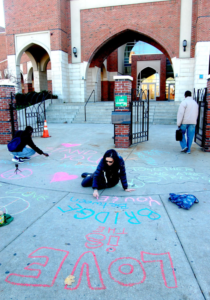 "Love is the bridge." MassMovement activists write on the sidewalk outside the Islamic Society of Boston Cultural Center on Malcolm X Boulevard, Boston, Nov. 18, 2016. (Greg Cook)