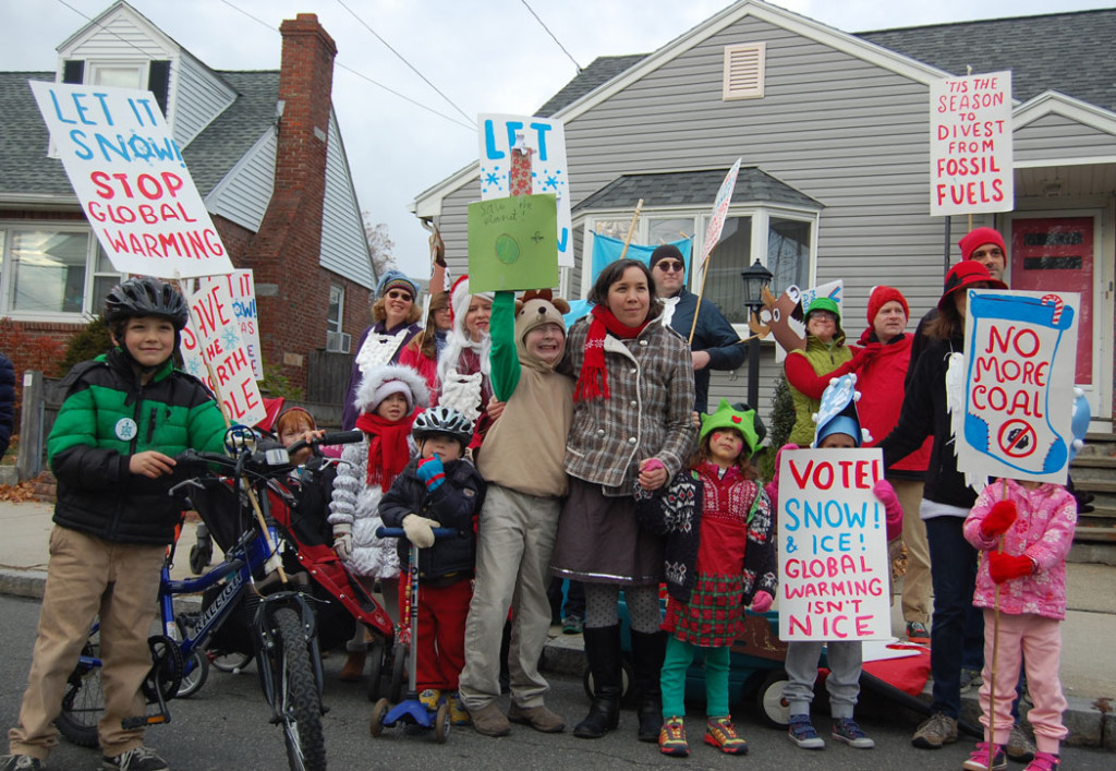 “Let It Snow! Santas Against Global Warming!” group in Malden’s annual Parade of Holiday Traditions, Nov. 26, 2016. (Greg Cook)