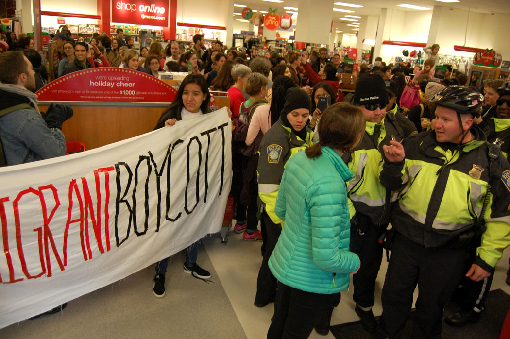 "Since you arranged this, we're going to arrest you first," a police sergeant threatens the protesters' police liaison at T.J. Maxx. (Greg Cook)