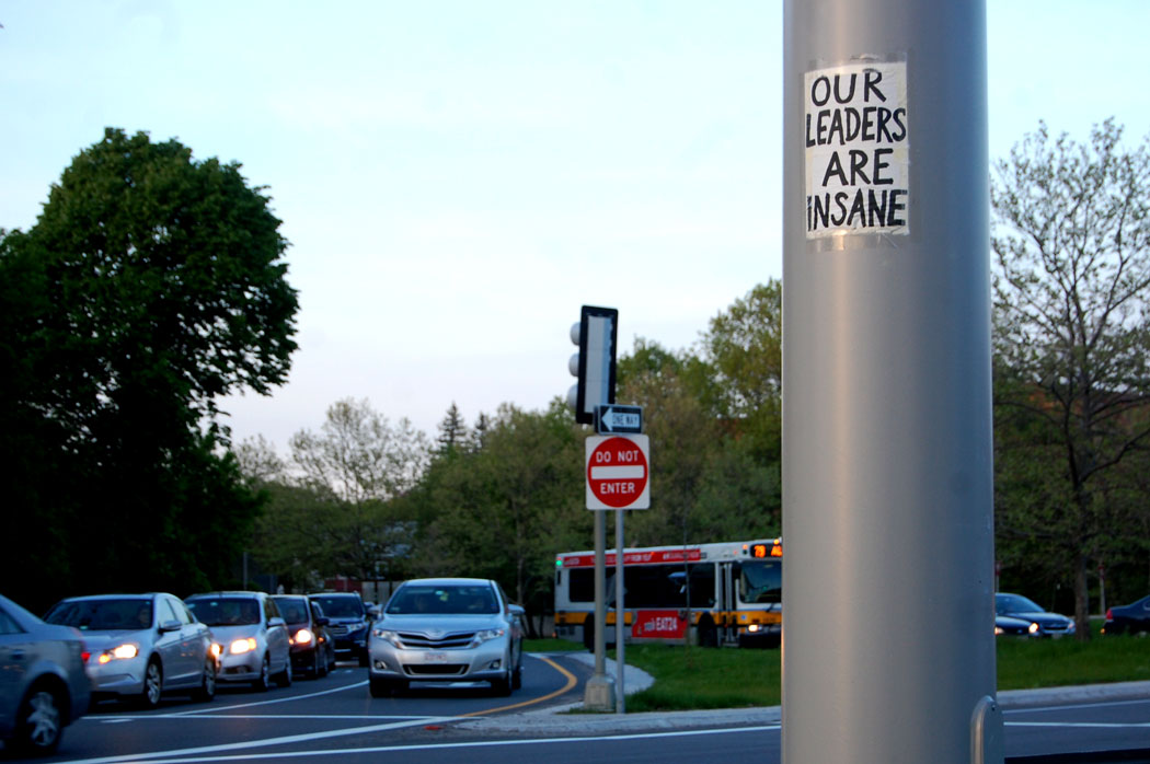 "Our Leaders Are Insane" sign spotted at Alewife, Cambridge, May 16, 2017. (Greg Cook)