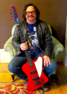 Tim Catz with his beloved red Gibson Thunderbird bass now.(Courtesy Tim Catz)