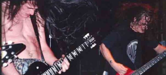 Tim Catz (right) plays his beloved red Gibson Thunderbird bass in the early 1990s. (Courtesy Tim Catz)