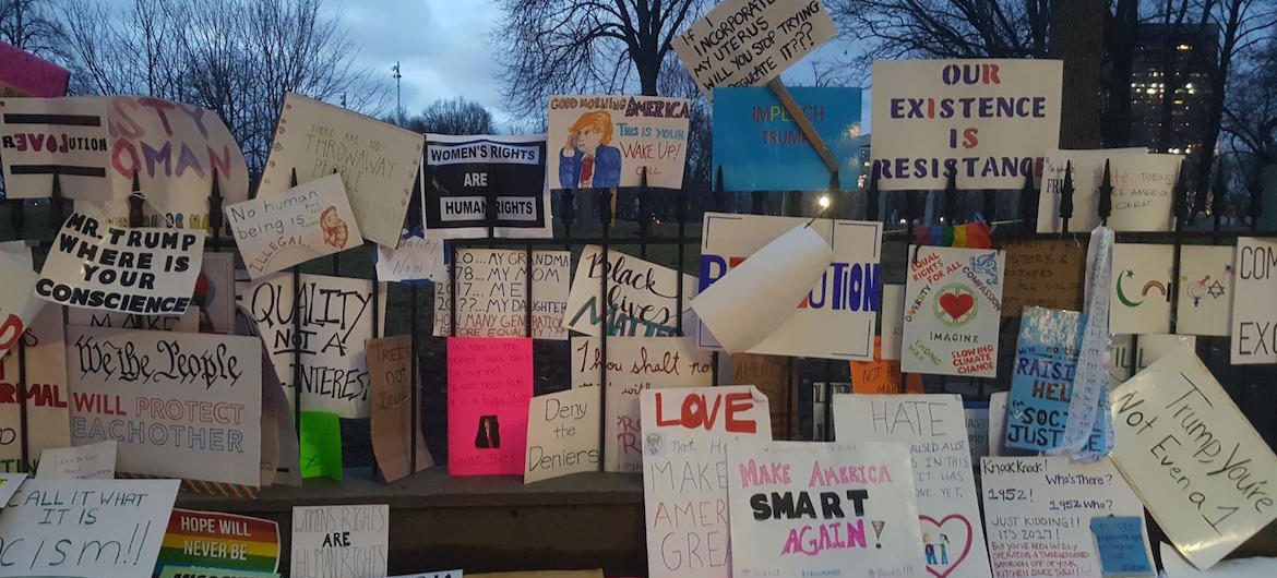 2017 Boston Women's March signs left along the iron fence of theCentral Burying Ground at Boston Common. (Nathan Felde)