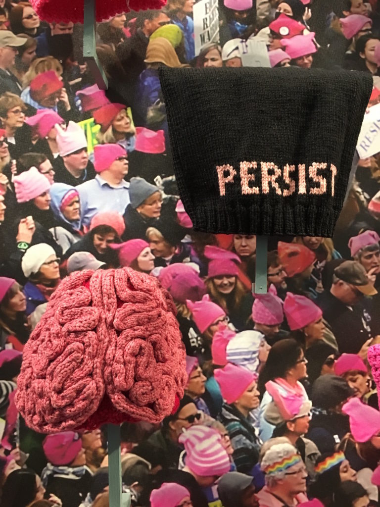 Pussyhats by Rachel Shannon Brown (left) and Kathleen Doherty. (Courtesy of Fuller Craft Museum)