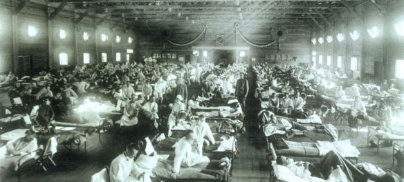 Historical photo of the 1918 Spanish influenza ward at Camp Funston, Kansas, showing the many patients ill with the flu. Circa December 1917. (U.S. Army photographer)