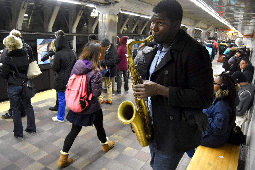 Musician performing in Downtown Crossing MBTA Station, Feb. 22, 2018. (Greg Cook)