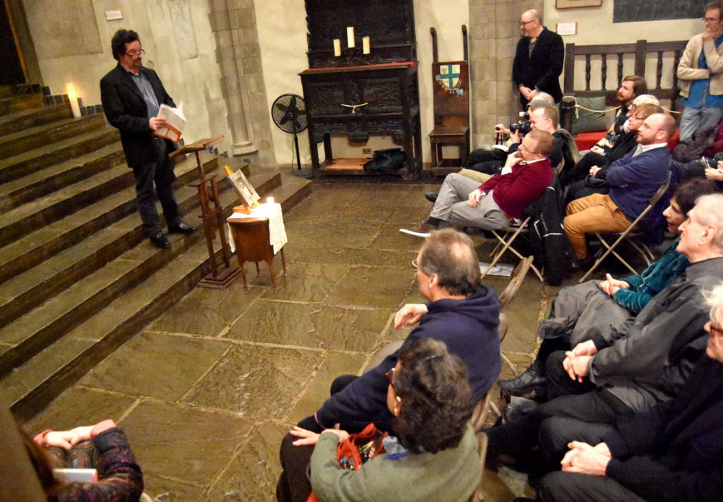 Jim Dunn speaks at the memorial for Gerrit Lansing at Gloucester's Hammond Castle, Feb. 24, 2018. (Greg Cook)