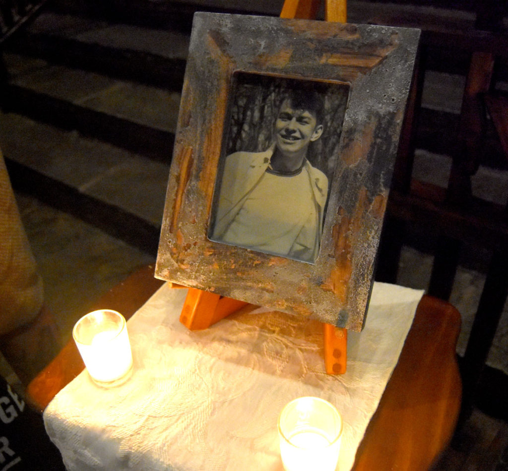 Photo of Gerrit Lansing on display at the front of the hall during the memorial for him at Gloucester's Hammond Castle, Feb. 24, 2018. (Greg Cook)