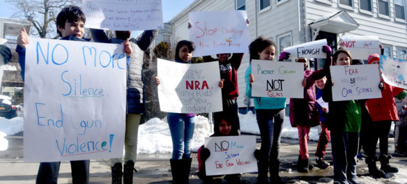 "No more silence, end gun violence!" Elementary students from Cambridgeport School protest guns on Broadway in Cambridge, March 15, 2018. (Greg Cook)