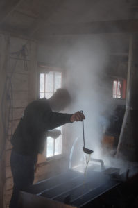 Boiling maple sap down to syrup in the Ipswich River Wildlife Sanctuary sugar house in Topsfield, March 2014. (Greg Cook)