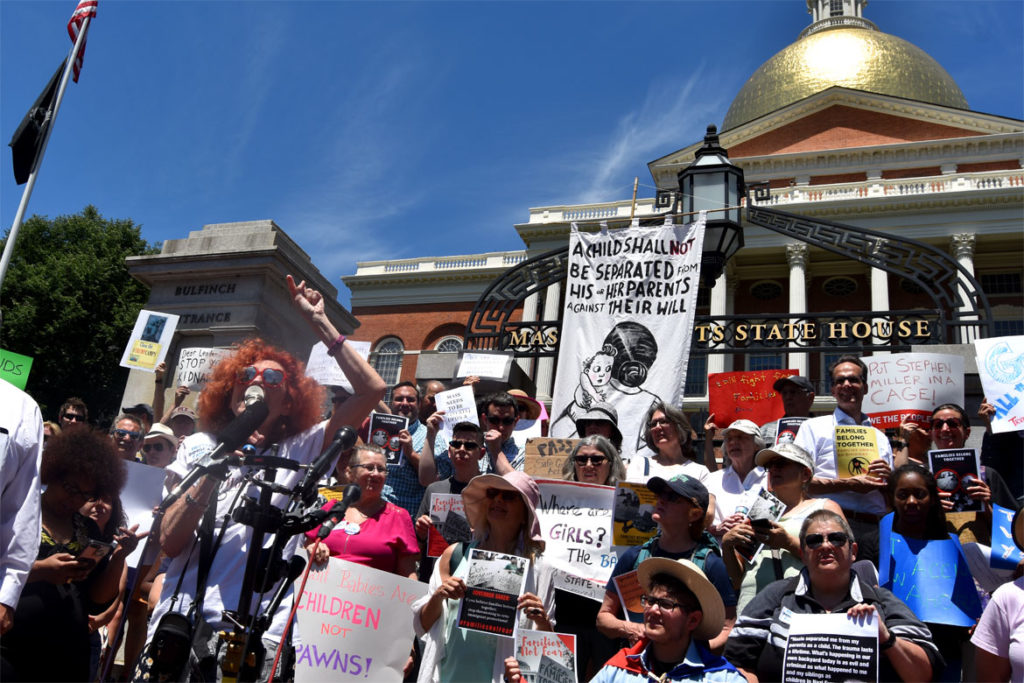 Heloise Galvao speaks at the "State House action to protect immigrant families in Massachusetts" at Massachusetts State House, Boston, June 20, 2018. (Greg Cook)