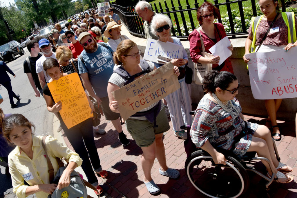 Protesters line up to enter Massachusetts State House in Boston to call on legislators to support undocumented immigrants. June 20, 2018. (Greg Cook)