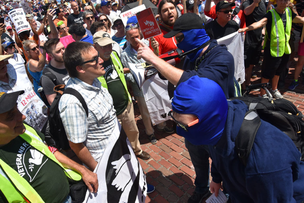 Counter-protesters confront the crowd at the “Together and Free: Rally Against Family Separation" at Boston City Hall, June 30, 2018. (Greg Cook)