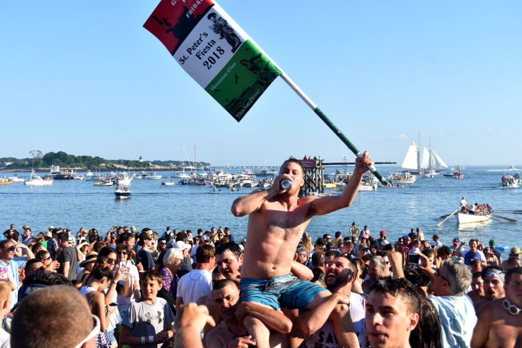 Frank Taormina is carried up Pavilion Beach by fellow Greasy Pole walkers after winning the contest, June 29, 2018. (Greg Cook)
