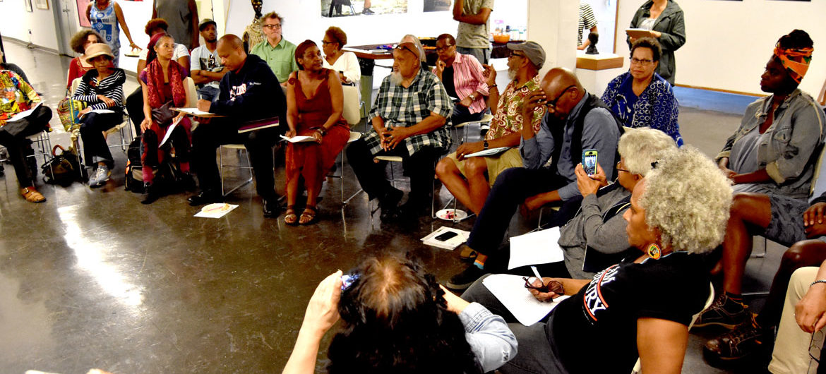 African American Master Artists In Residence Program artists and supporters meet in the fourth-floor gallery at the studios at 76 Atherton St., Boston, Aug. 12, 2018. (Greg Cook)
