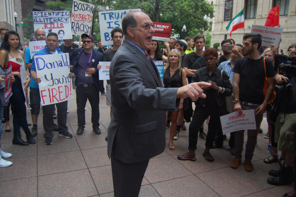 “This is our country,” Congressman Michael Capuano of Massachusetts said, “and there is no way we’re going to let him take it in the direction he wants to go.” At protest of Donald Trump at Langham Hotel in Boston, June 29, 2016. (Greg Cook)