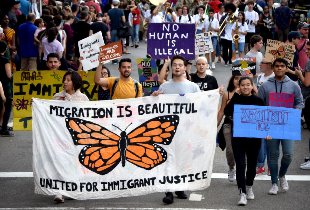 Migration Is Beautiful group in the Honk Parade, Oct. 7, 2018. (Greg Cook)