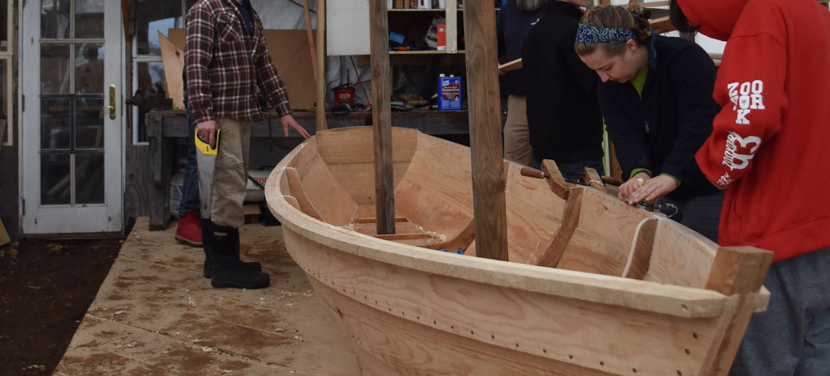 Constructing an Essex clamming skiff at the Essex Historical Society and Shipbuilding Museum in Essex, April 26, 2018. (Greg Cook)