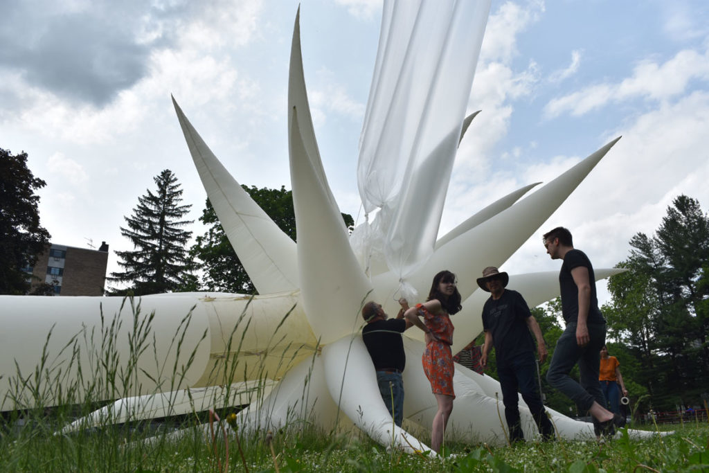 Attaching helium tubes to Otto Piene's "Sky Art" inflatable sculpture "Paris Star" at the Fitchburg Art Museum, June 2, 2019. (Greg Cook)