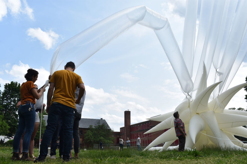 Attaching helium tubes to Otto Piene's "Sky Art" inflatable sculpture "Paris Star" at the Fitchburg Art Museum, June 2, 2019. (Greg Cook)