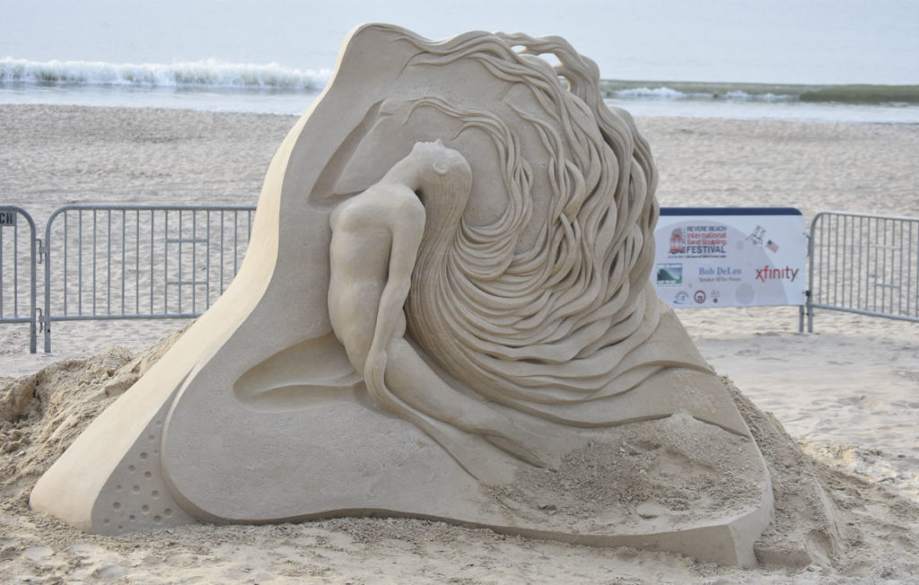 Sculpture by Fergus Mulvany of Ireland at the Revere Beach International Sand Sculpting Festival, Massachusetts, July 27, 2019. (Greg Cook)