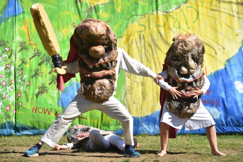 Police arrest moms in Bread and Puppet Theater's "Diagonal Life Circus," Glover, Vermont, Aug. 25, 2019. (Greg Cook)