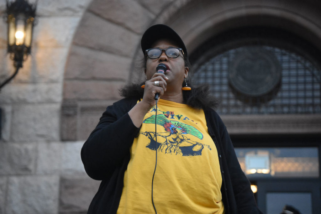 Cambridge Carnival President Nicola A. Williams speaks at the “Unity Rally” on the steps of Cambridge City Hall in response to the cancellation of the 2019 Carnival. Sept. 4, 2019. (Greg Cook)