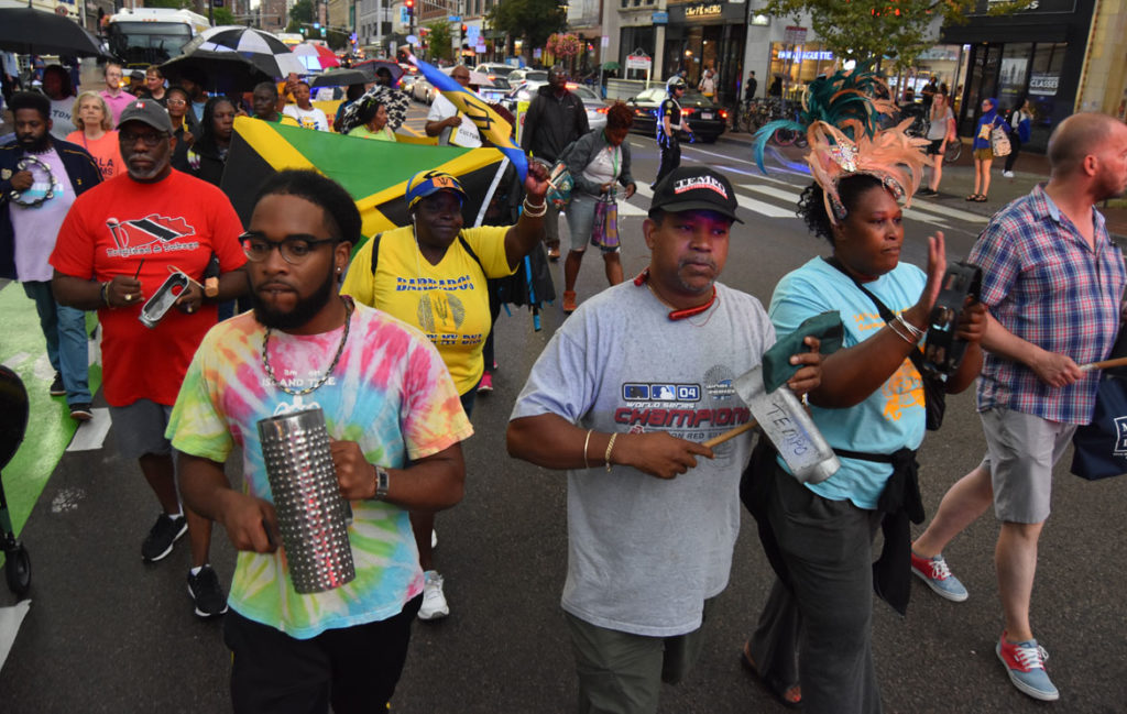 “March for Peace” down Cambridge's Massachusetts Avenue in response to the cancellation of the 2019 Carnival. Sept. 4, 2019. (Greg Cook)