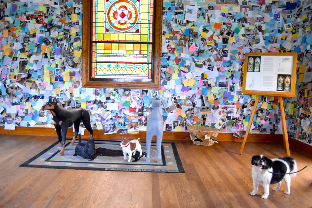 Visitor at Stephen Huneck's Dog Chapel, St. Johnsbury, Vermont, during a Dog Party on June 23, 2018. (Greg Cook)