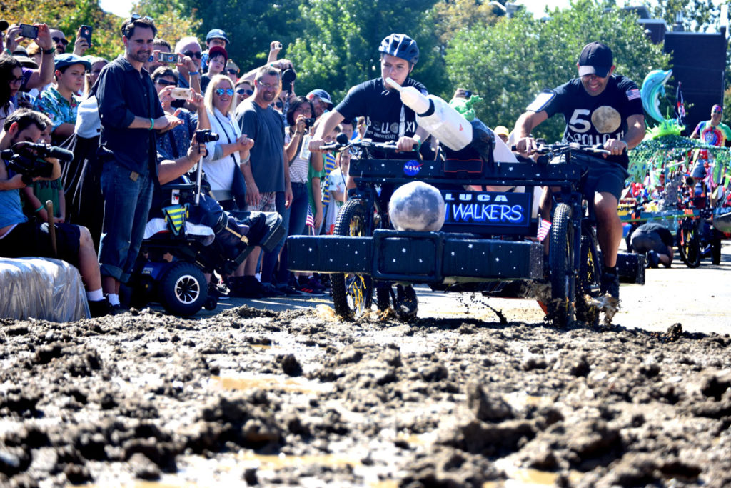 The Lowell Kinetic Sculpture Race enters the “Maddening Mud Pit," Sept. 21, 2019. (Greg Cook photo)