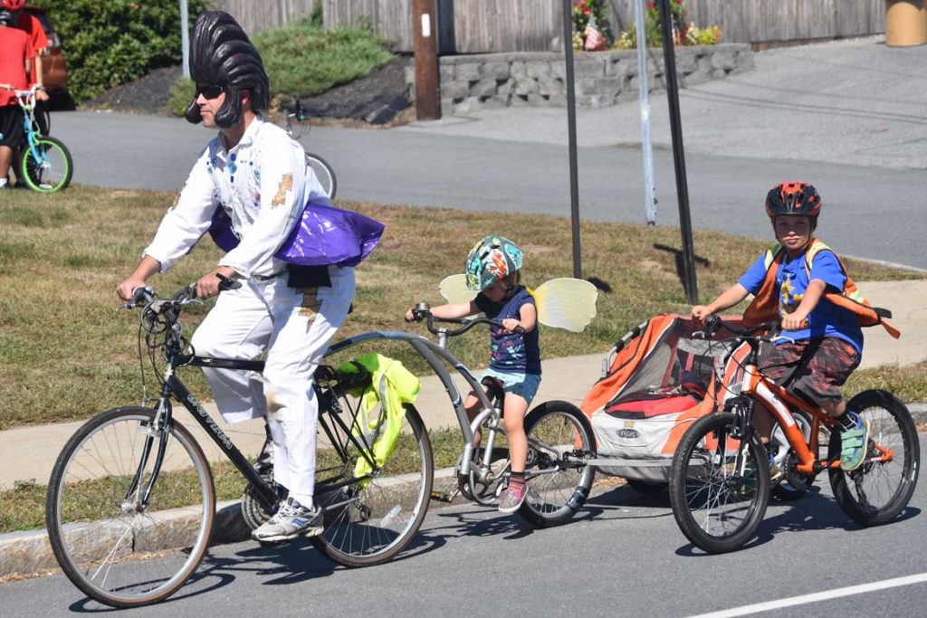 Pedaling along the VFW Highway during the Lowell Kinetic Sculpture Race, Sept. 21, 2019. (Greg Cook photo)