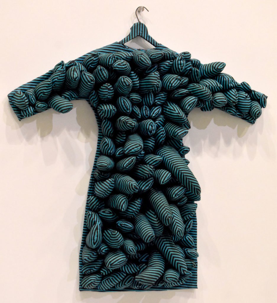 Yayoi Kusama, "Blue Coat," 1965, stuffed and sewn aqua and black striped cotton, wire hanger.