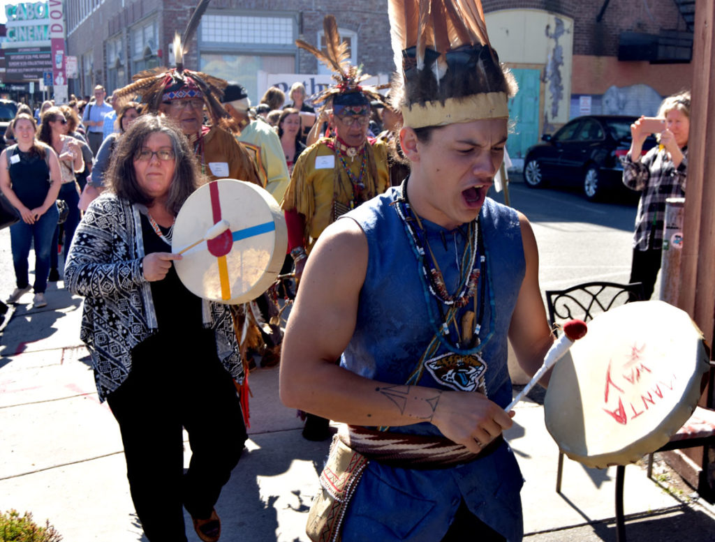 Massachusetts Center for Native American Awareness Intertribal Dancers from Danvers lead the crowd at the Essex County Community Foundation's second annual Essex County Arts & Culture Summit from the Cabot theater to Dane Street Church, Beverly, Sept. 27, 2019. (Greg Cook photo)
