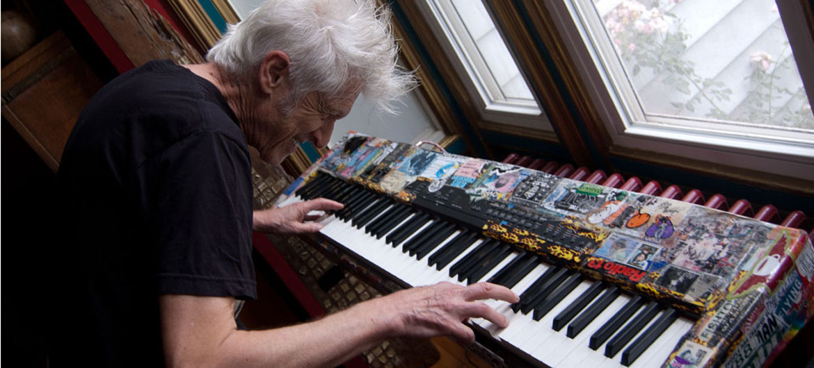 Willie Alexander plays his keyboard in his Gloucester home, July 15, 2017. (Greg Cook photo)