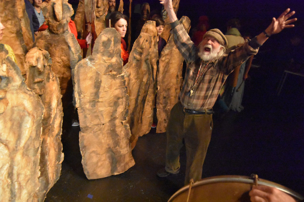 Peter Schumann (right) demonstrates a yell during a rehearsal of Bread and Puppet Theater's “Honey Let’s Go Home! Opera” at Theater for the New City, New York, Dec. 6, 2019. (Greg Cook photo)