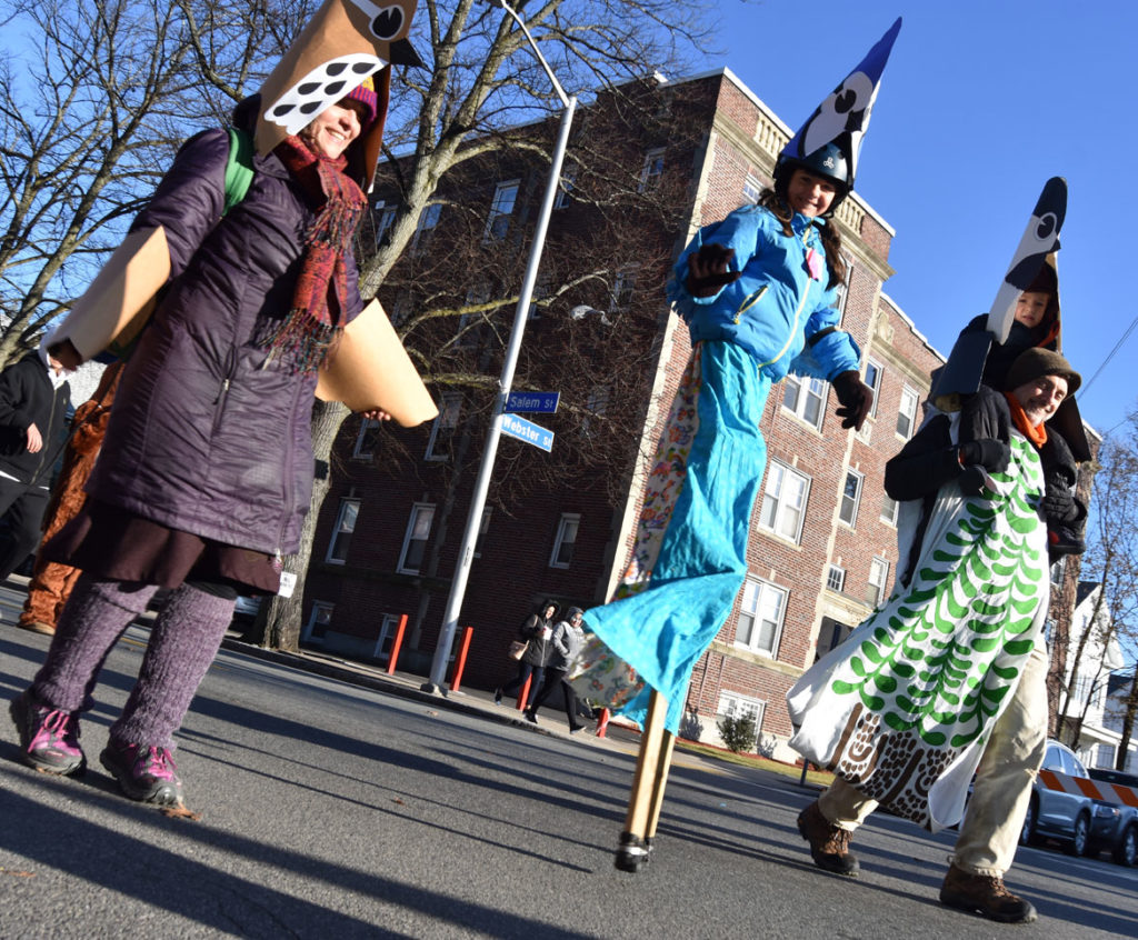"Songbirds for Diversity" by Wonderland Spectacle Co. and friends in Malden Parade of Holiday Traditions, Nov. 30, 2019. (Greg Cook photo)