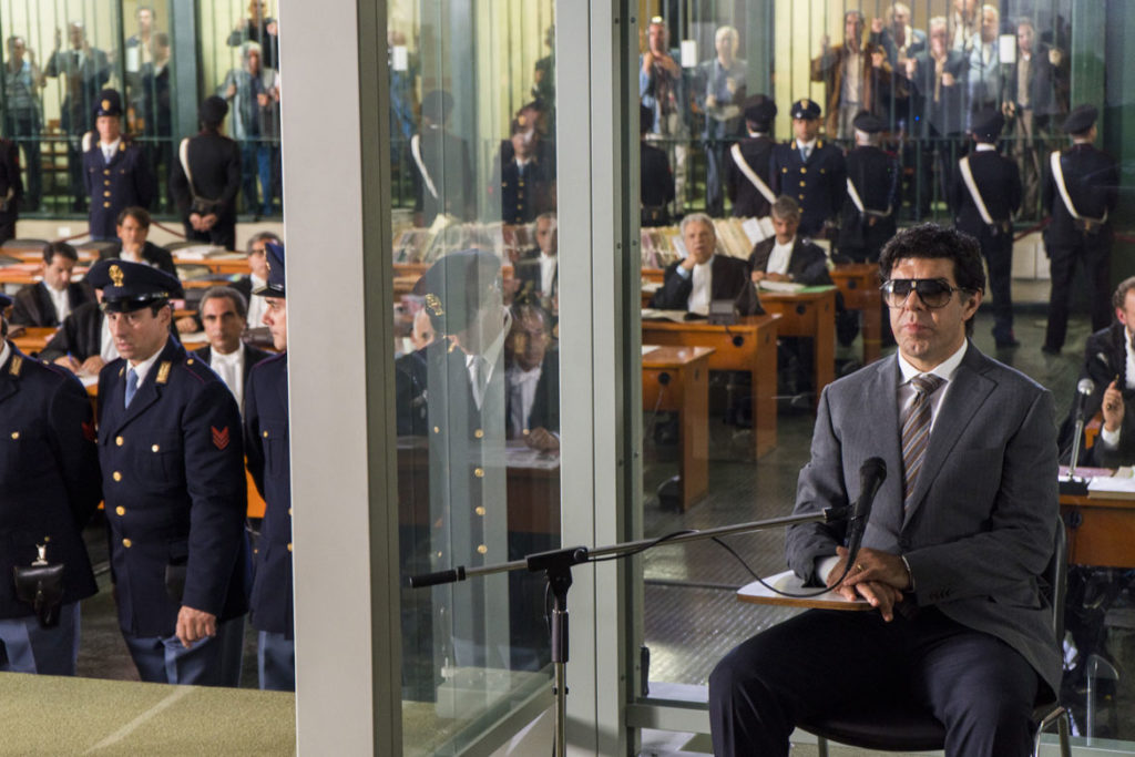 In "The Traitor," Tommaso Buscetta (played by Pierfrancesco Favino) testifies in the 1986 “Maxi Trial” that saw 360 convictions won against gangsters. (Sony Pictures Classics)