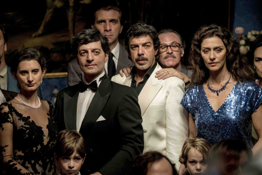 In "The Traitor," Tommaso Buscetta (played by Pierfrancesco Favino) poses for a photo with fellow mobsters and their families. (Sony Pictures Classics)