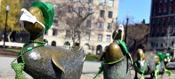Nancy Schon's 1987 "Make Way for Ducklings" statues wear masks to protect them from coronavirus at Boston Public Garden, March 22, 2020. (Greg Cook photo)