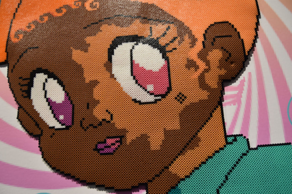 Detail of Momo Pixel artwork made from fuse beads in the exhibition "Game Changers" at the MassArt Art Museum, Feb. 25, 2020. (Greg Cook)