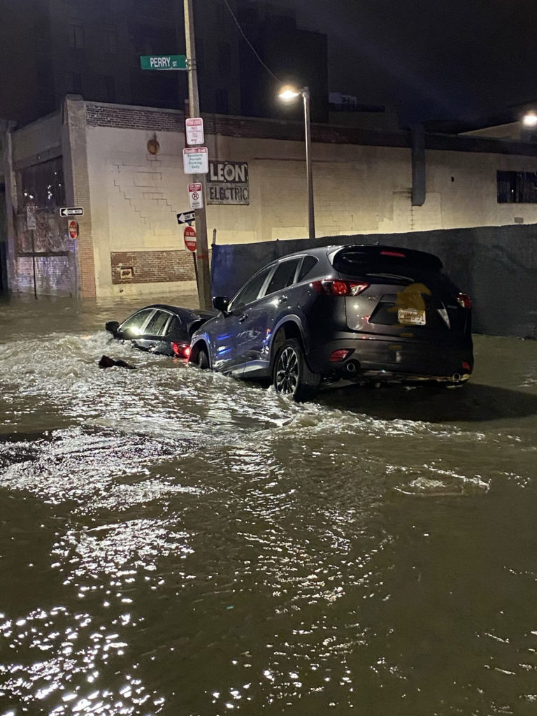 Flooding from a water main break submerged vehicles on Harrison Avenue at Perry Street in Boston, April 14, 2020. (Boston Fire Department photo)