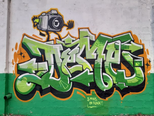Art by Deme5 created at the “Back Against the Wall: Graffiti in Grove Hall” event at Moses Auto in Boston's Dorchester neighborhood on May 15, 2021. (Courtesy Sobek)
