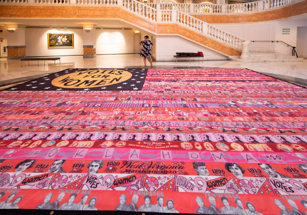 “Her Flag” created by Oklahoma artist Marilyn Artus (pictured) and collaborators on view at the National Museum of Women in the Arts, Washington, D.C., June 2021. (Courtesy National Museum of Women in the Art / Kevin Allen photo)