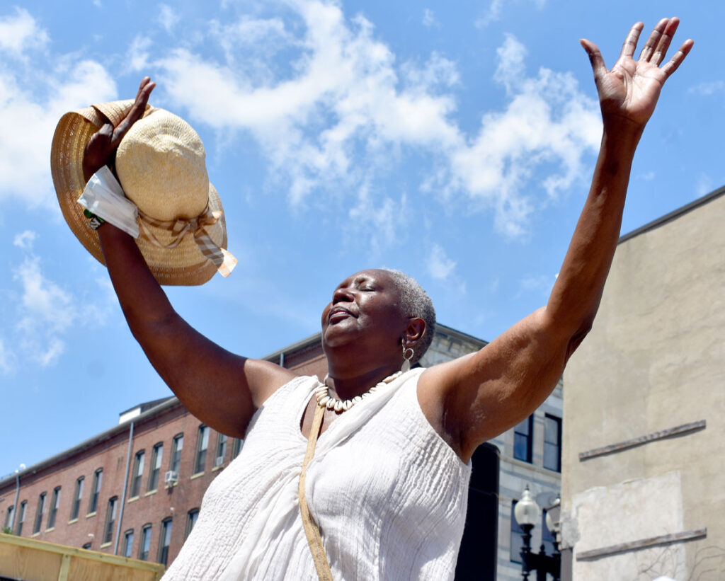 Ring shout at Ife Franklin's Juneteenth Celebration at Black Market Nubian Square as part of the premiere of her film "The Slave Narrative of Willie Mae," June 19, 2021. (©Greg Cook photo)
