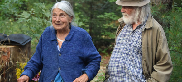 Elka and Peter Schumann in the pine forest at Bread and Puppet, Glover, Vermont, Aug. 18, 2018. (©Greg Cook photo)