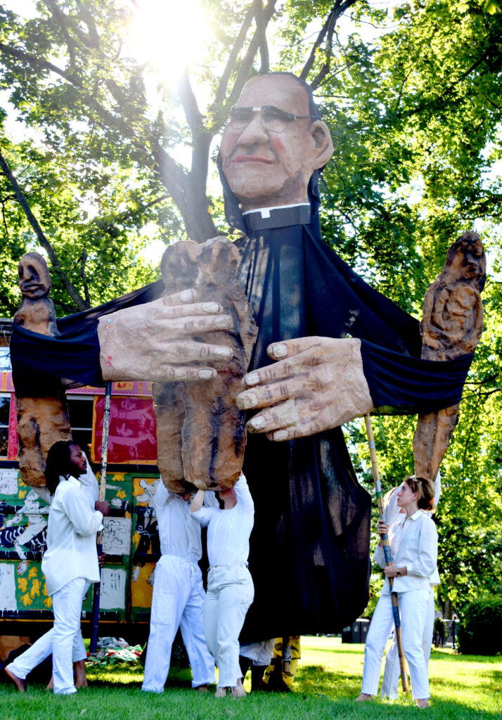 Remembering the 1980 murder of Archbishop Oscar Romero in El Salvador during Bread and Puppet Theater's "Circus" at Cambridge Common, Sept. 4, 2021. (©Greg Cook photo)